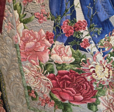 Close-up showing intricate custom quilting texture on a quilt top.