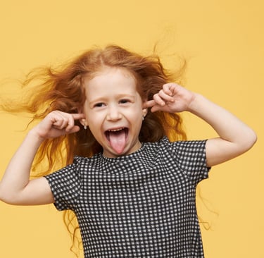 a young girl with her tongue sticking out of her tongue
