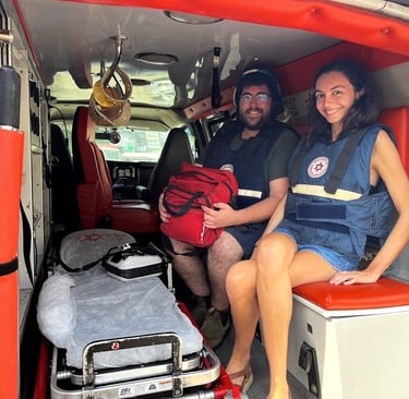 Oceane Maher and Seth Greenwald volunteering with Operation Manna and Magen David Adom