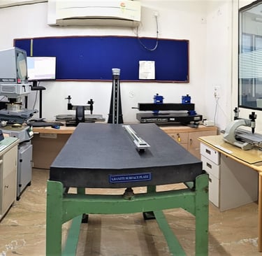 a room with a desk calibrated Industrial Instruments at NABL Certified LABand a computer monitor