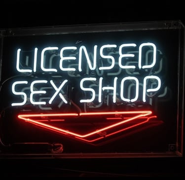 neon sign that reads licensed sex shop
