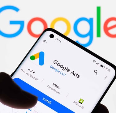 man holding phone google ads