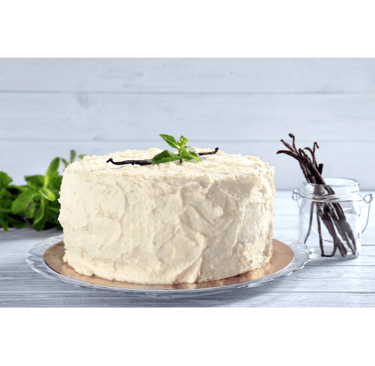 a cake with vanilla cream frosting and vanilla beans