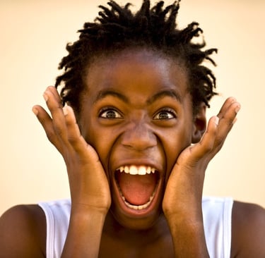 a young girl with her hands on her face