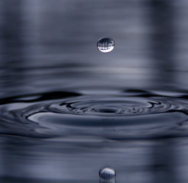 a drop of water in a pool of water