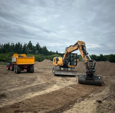 a tractor with a dump truck behind it