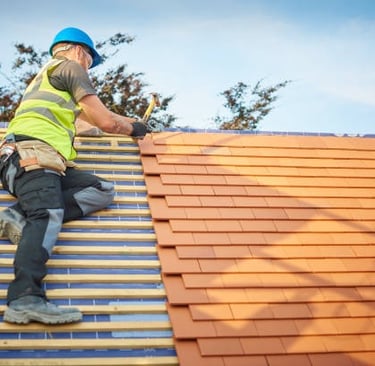 man installing a new orange roof