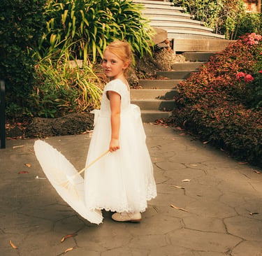 Flower girl portrait with parasol Avalon Castle Melbourne wedding garden path