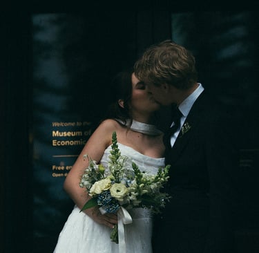 Bride and groom sharing a quiet moment outside the museum at Adelaide Botanic Garden