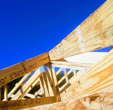a wooden frame roof with a wooden roof and a metal roof