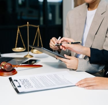 client reviewing document with attorney