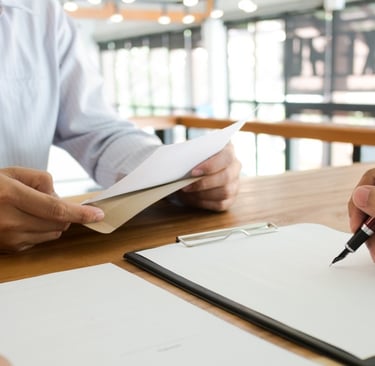 lawyer writing and meeting with client