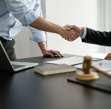 lawyer shaking hands with client