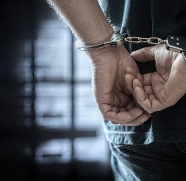 person in handcuffs from behind