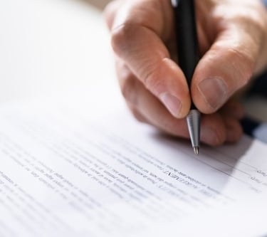 lawyer signing a document