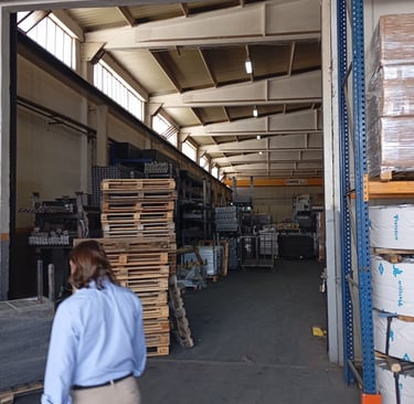 a man walking through a factory
