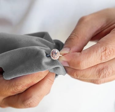 a woman carefully polishing a cremation ashes ring