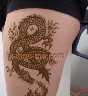 dragon on girl’s thigh