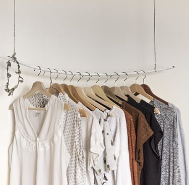 Clothes on a rack showing fresh, updated styles.