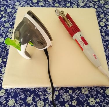 "DIY portable ironing board with a mini steam iron and a Clover craft iron resting on top, displayed