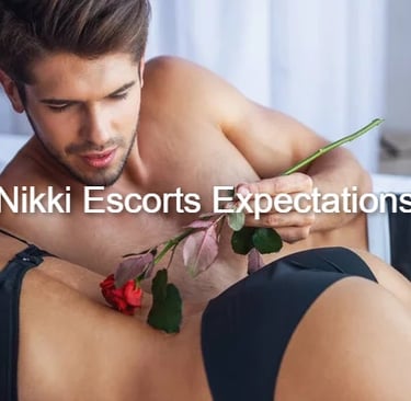 A handsome man lying in bed holding a red rose over a woman, illustrating Nikki Escorts expectations.