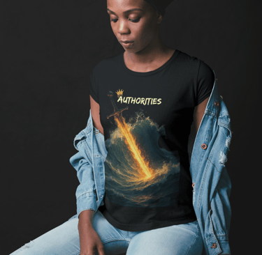Woman wearing black t-shirt with flaming sword cutting through ocean waves and the word "AUTHORITIES