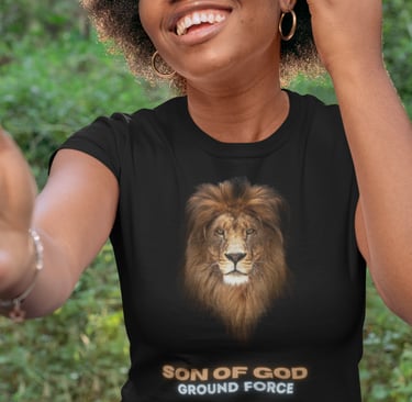 Smiling woman wearing black "Son of God Ground Force" t-shirt with lion face design.