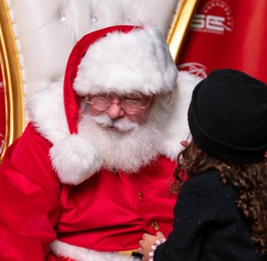 The santa Cowboy being told a secret Christmas wish
