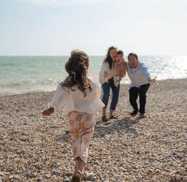 Family photography Brighton beach outdoor session parents and child natural moment