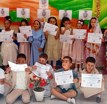 Moroccan students proudly holding academic certificates during a school graduation ceremony celebration.