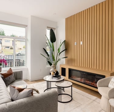 Professionally staged modern living room with neutral tones, designer furniture, and decor.