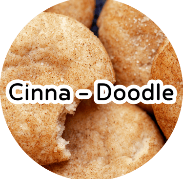 Cinnamon sugar snickerdoodle cookies with a bite taken out and text reading "Cinna - Doodle."