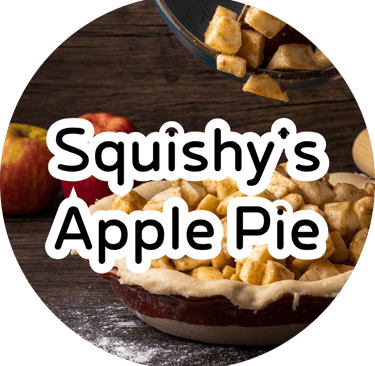Slices of spiced apples being poured into a raw pie crust, with whole red apples and a rolling pin in the background.