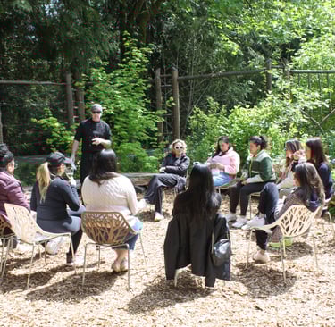 Seattle corporate team having a wine tasting in the sunshine during their retreat