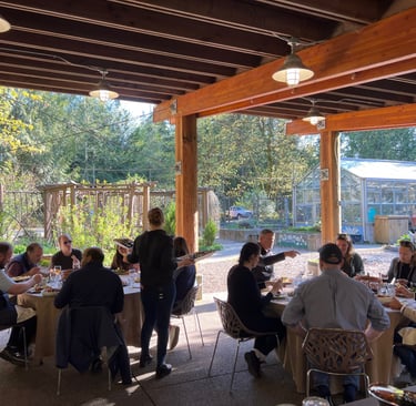 Seattle corporate team eating lunch outdoors during a team building experience