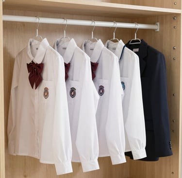 A vibrant display of Wonder Wings MySchool Kit uniforms neatly arranged on hangers, showcasing the bright colors and quality fabric.