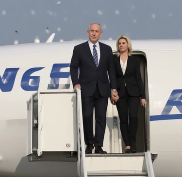 a hotel sign lit up in the dark