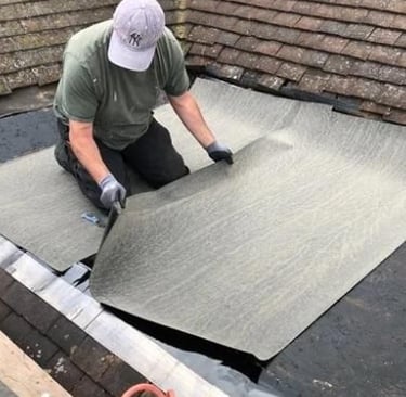 Roof repair contractor replacing missing shingles after storm in Forest Lakes Charlottesville