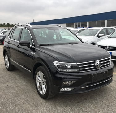 a white car parked in front of a building