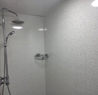 Shower area inside a temporary bathroom pod supplied during insurance claims and renovation projects.