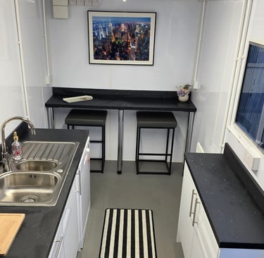 Interior of a fully equipped temporary kitchen pod provided during insurance claims and home renovation projects.