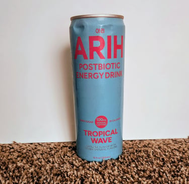 A can of ARIH Postbiotic energy drink, flavor Tropical Wave