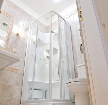 White hydromassage shower cabin with built-in seat and body jets