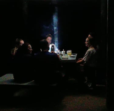 Atmospheric dinner setting for guests staying inside Deramakot Forest Reserve, Borneo