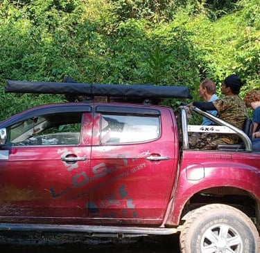 A local guide sharing his knowledge to visitors during the ongoing safari