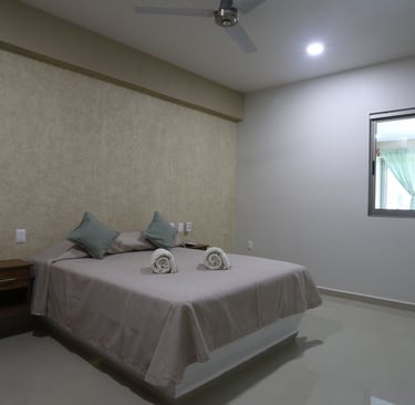 Habitación matrimonial en bungalows a pie de playa