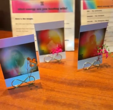 Aura portraits on stands with small dried flowers.