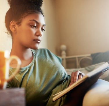 Cropped shot of a young female student studying at home