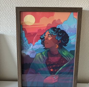 Framed fantasy illustration of a woman with blue hair against a sunset mountain landscape.