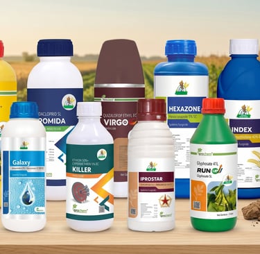 A collection of agricultural pesticide and herbicide bottles displayed on a wooden table with a field background.